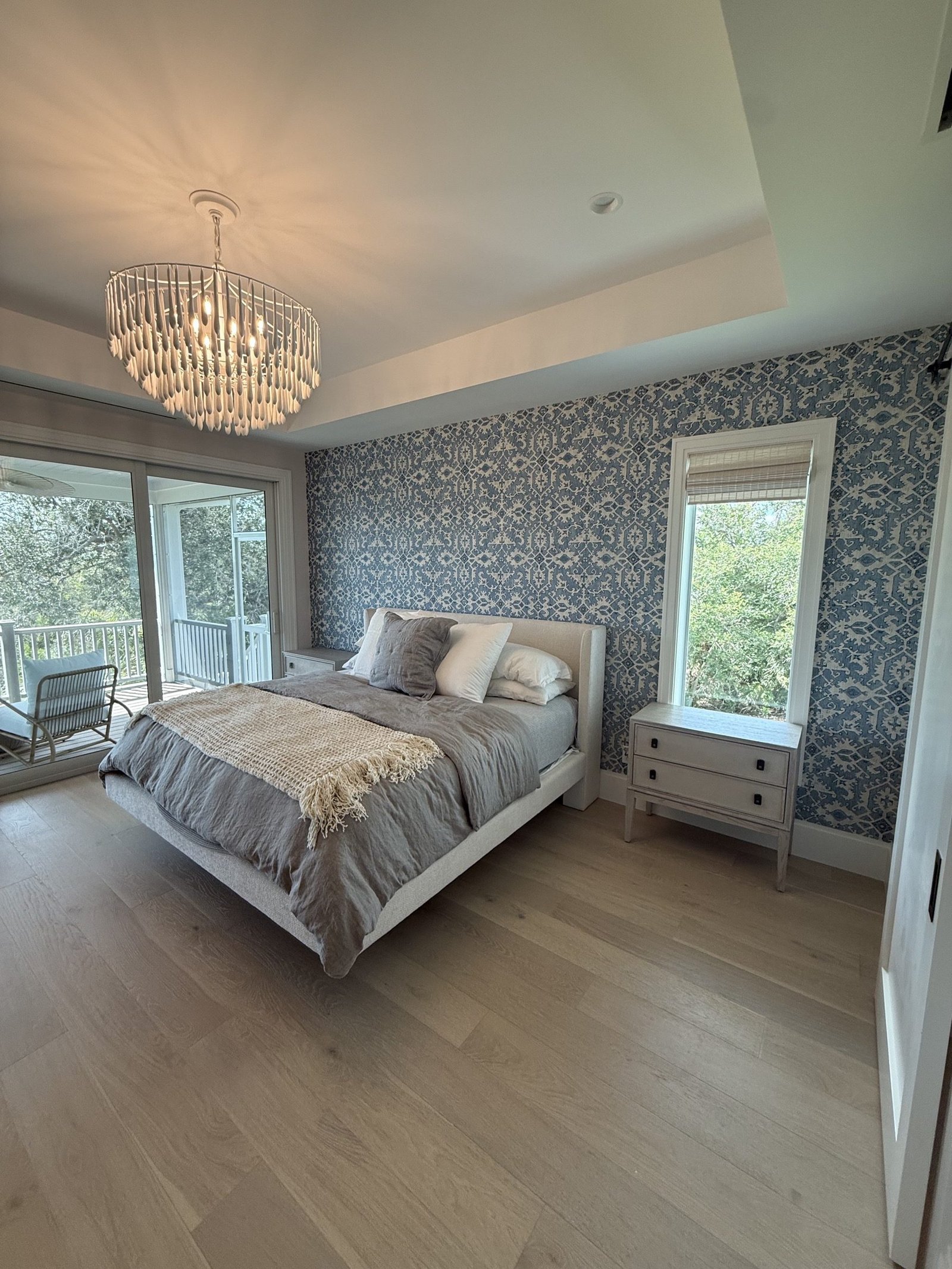 Professional blue patterned wallpaper installation in a Tampa Bay bedroom